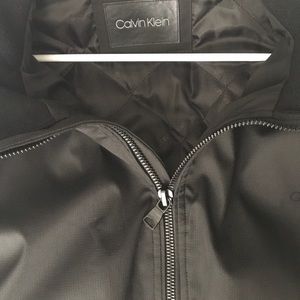 Black Calvin Klein (CK) bomber jacket.